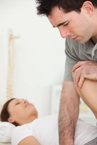 Patient being stretched by a physiotherapist — Stock Photo, Image