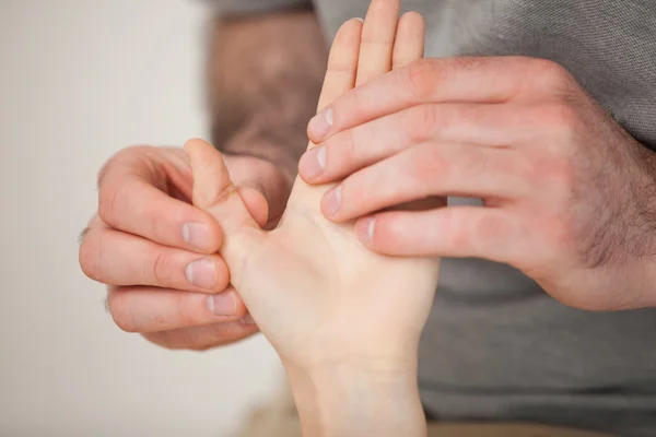 Thumb being massaged by a doctor — Stock Photo, Image