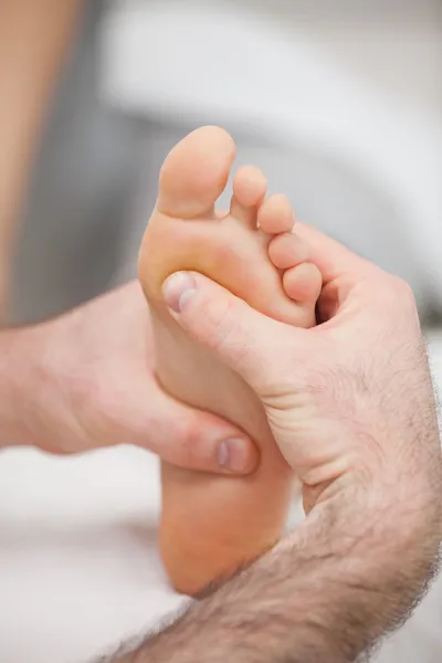 Sole of foot being massaged — Stock Photo, Image