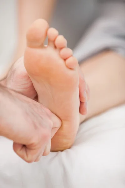 The ball of a foot being massaged — Stock Photo, Image