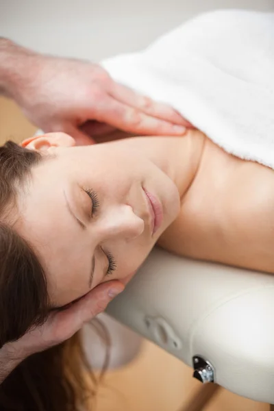Neck of a patient being massaged by a chiropractor — Stock Photo, Image