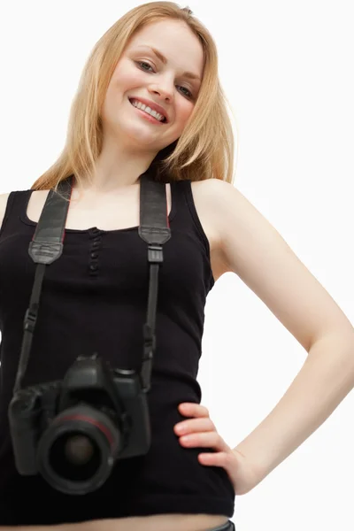 Joyful woman holding a camera — Stock Photo, Image