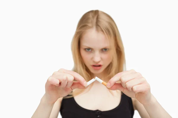 Angry woman braking a cigarette — Stock Photo, Image