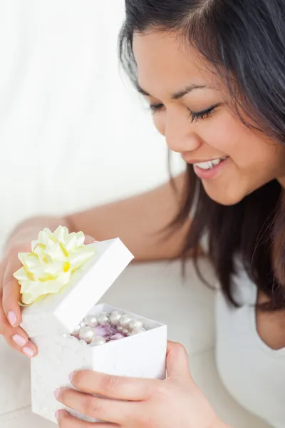 Close-up of a woman looking in an open gift box — Stock Photo, Image