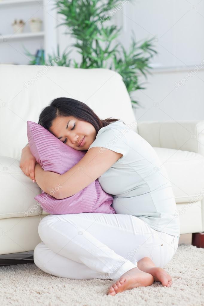 holding pillow while sleeping