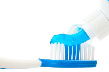 Close up of a toothpaste on a toothbrush clipart