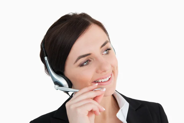 Mujer de negocios en traje negro usando un auricular —  Fotos de Stock