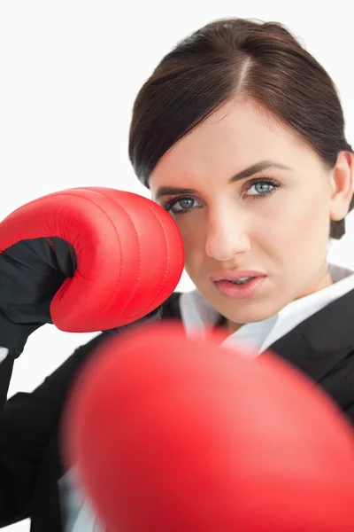 Beautiful woman boxing with red gloves — Stock Photo, Image