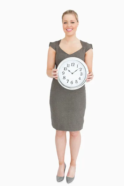 Woman holding a clock — Stock Photo, Image