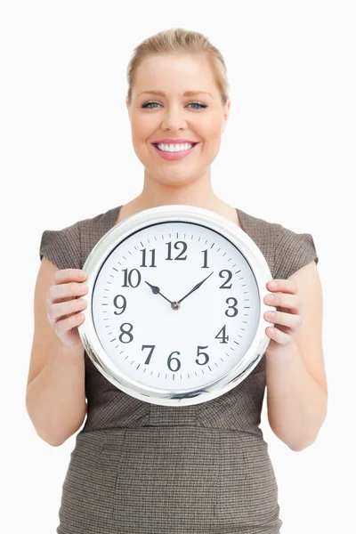 Woman holding a clock in her hands — Stock Photo, Image