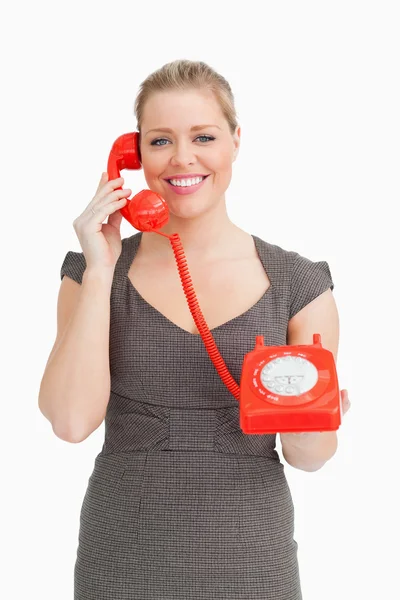 Woman calling with a dial phone — Stock Photo, Image