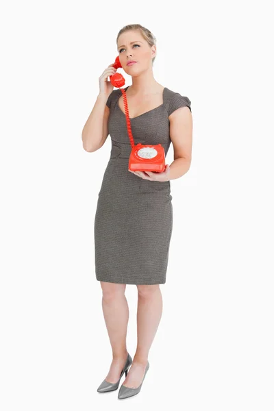 Woman calling someone with a retro phone — Stock Photo, Image