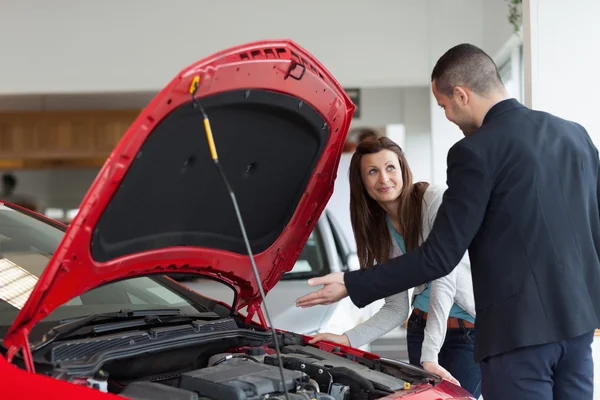 Man showing the car engine — Stock Photo, Image