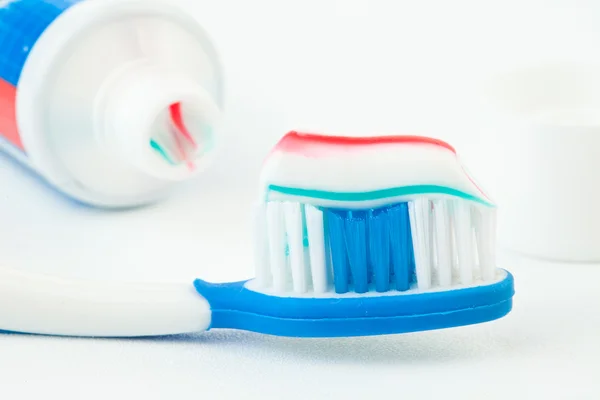 Tube of toothpaste with toothbrush — Stock Photo, Image