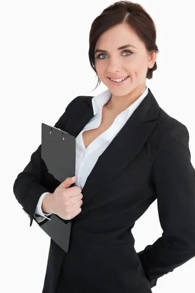 Happy businesswoman holding a clipboard Royalty Free Stock Images