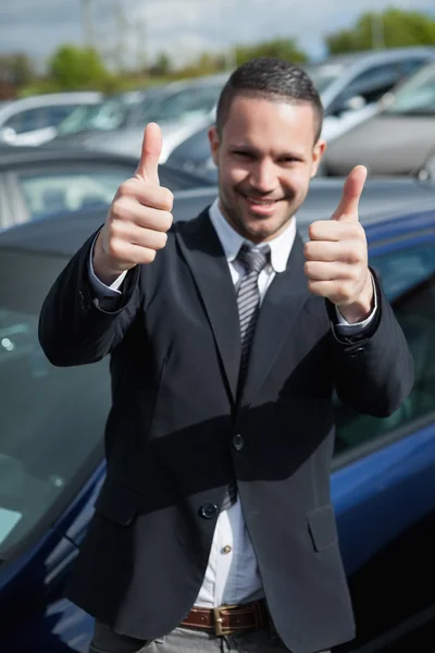 Happy man raising his thumbs Stock Photo
