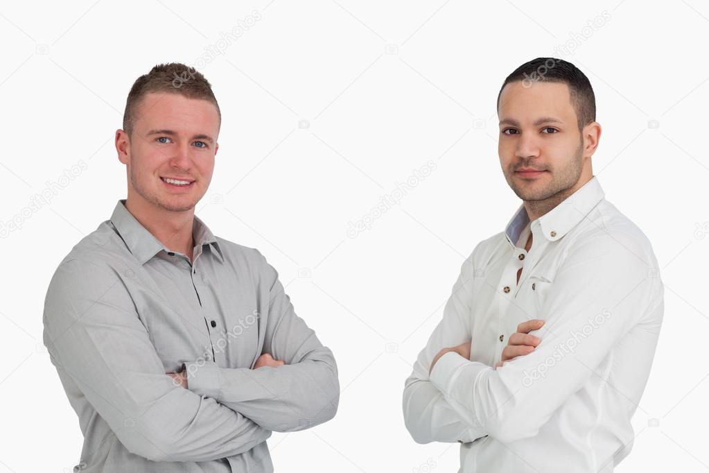 Two men crossing arms and standing side by side — Stock Photo