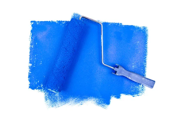 Rodillo de pintura sobre trazas azules —  Fotos de Stock