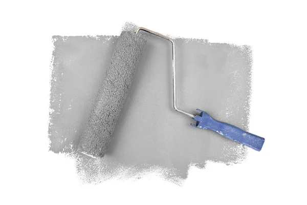 Paint roller on grey traces — Stock Photo, Image