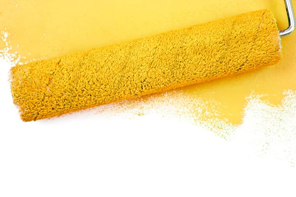 Yellow brush stroke and a paint roller — Stock Photo, Image