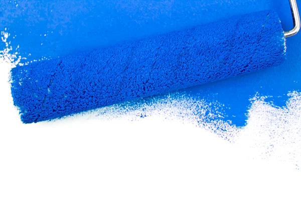 Blue brush stroke and a paint roller — Stock Photo, Image