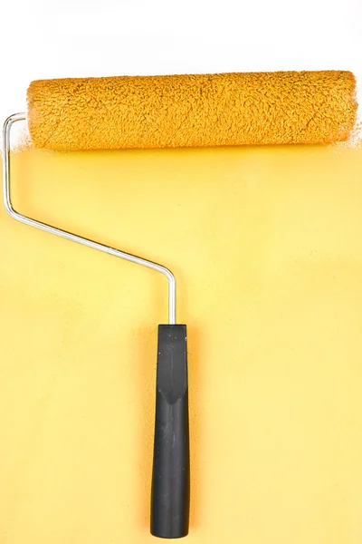 Yellow brush stroke with paint roller — Stock Photo, Image