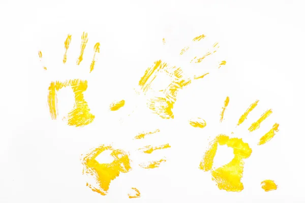 Cztery handprints żółty — Zdjęcie stockowe