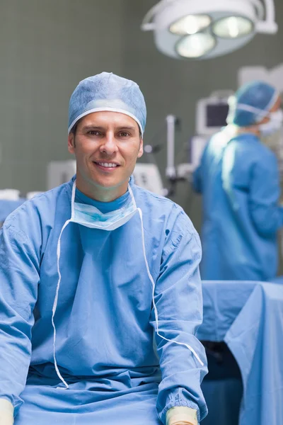 Practitioner wearing a surgical equipment — Stock Photo, Image