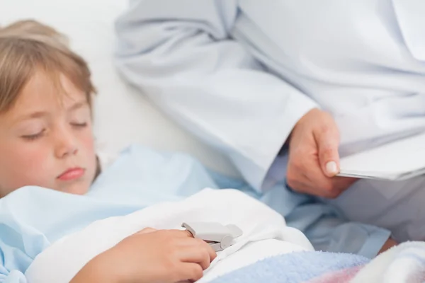 Child sleeping on a medical bed — Stock Photo, Image