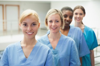 Female nurse looking at camera clipart