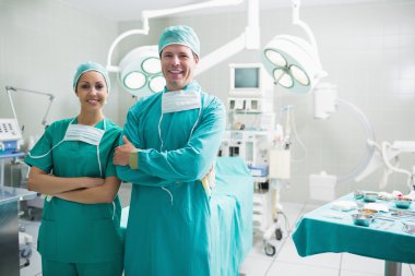 Surgeons standing up while smiling clipart