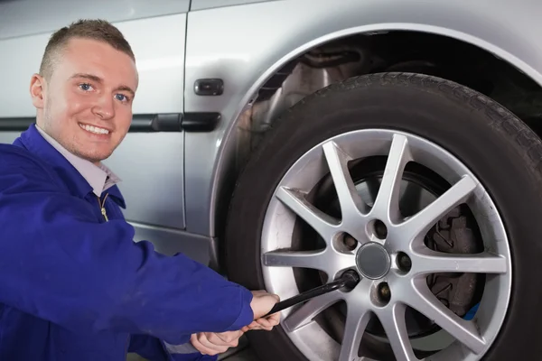 Mechanic holding a wrench — Stock Photo, Image