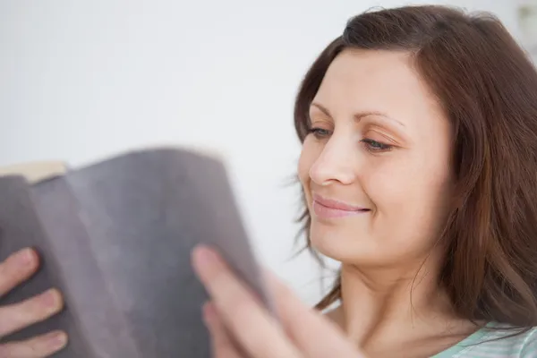 Woman looking at a book — Stock Photo, Image