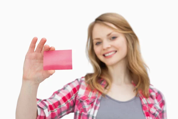 Smiling woman holding a loyalty card — Zdjęcie stockowe