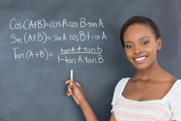 Student showing a blackboard — Stock Photo, Image