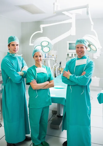 Surgeons smiling with arms crossed — Stock Photo, Image