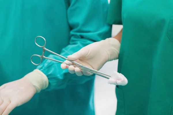 Close up of a surgical scissors with a compress — Stock Photo, Image