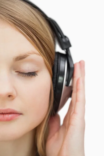 Close up of a woman with closed eyes listening music Stock Photo