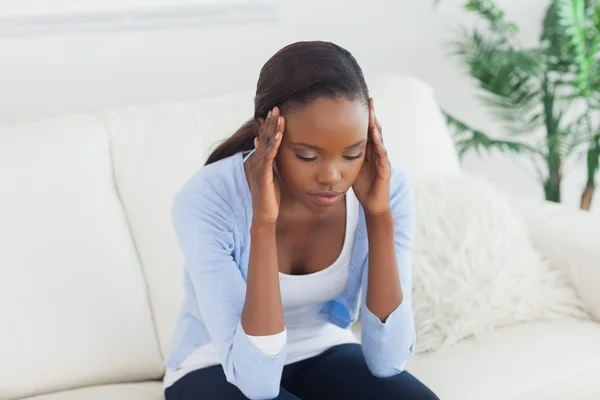 Black woman holding her head Royalty Free Stock Images