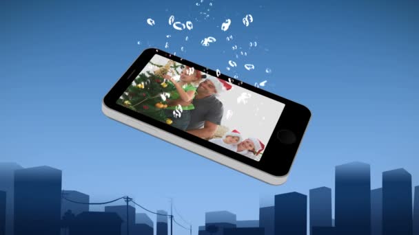 Смартфон, що показує сім'ю під час Різдва — стокове відео