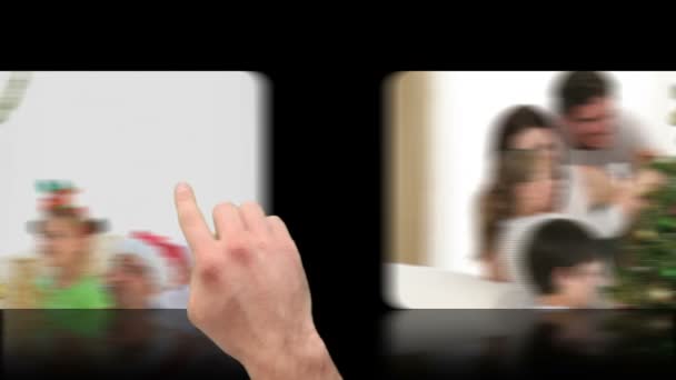Mão ativando vídeos de Natal na tela sensível ao toque — Vídeo de Stock