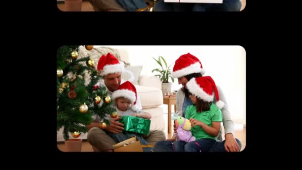 Hand scrolling vertically through and activating christmas videos — Stock Video