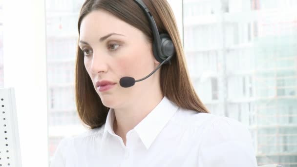 Close-up of young woman working in a call center — Stock Video