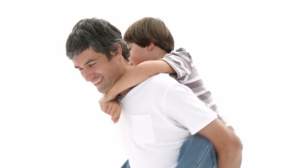 Father giving his son piggyback ride — Stock Video