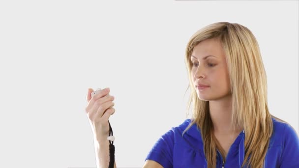 Woman holding a stop watch — Stock Video