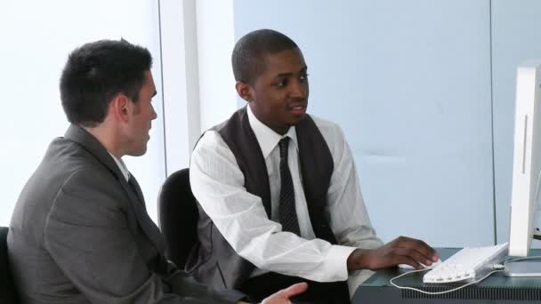 Afro-American businessman working in office with his colleague — Stock Video