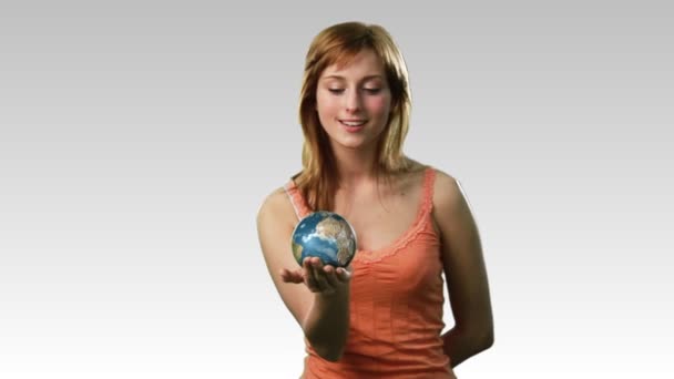 Attractive lady holding the earth — Stock Video