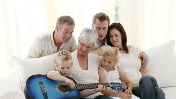 Intergenerational family at home sitting on sofa — Stock Video