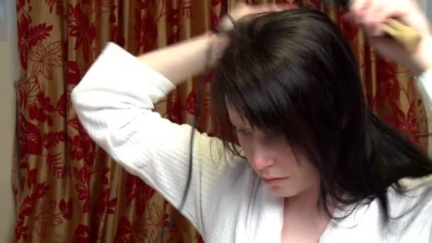 Beautiful woman drying her hair — Stock Video