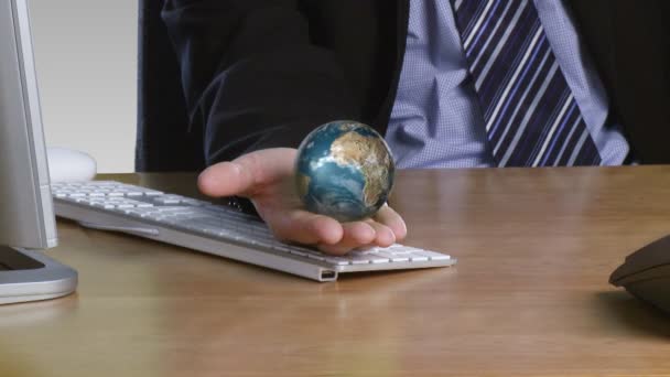 Businessman with a rotary globe on his open hand — Stock Video